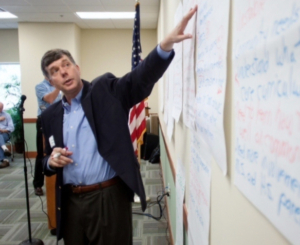 Evaluation - man pointing to white board