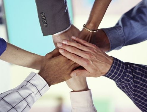 our consulting team page hands together